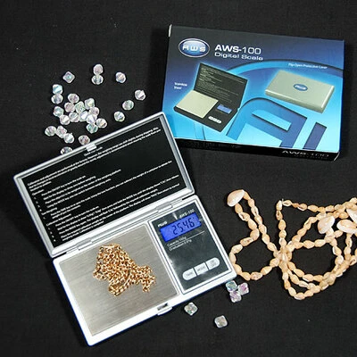 Scale- 100g Capacity x 0.01g Resolution- Extra High Resolution. Flip Open Cover Protects Surface-